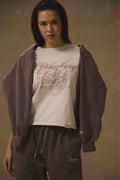 Model wearing Pennbury Cross Country baby tee with joggers
