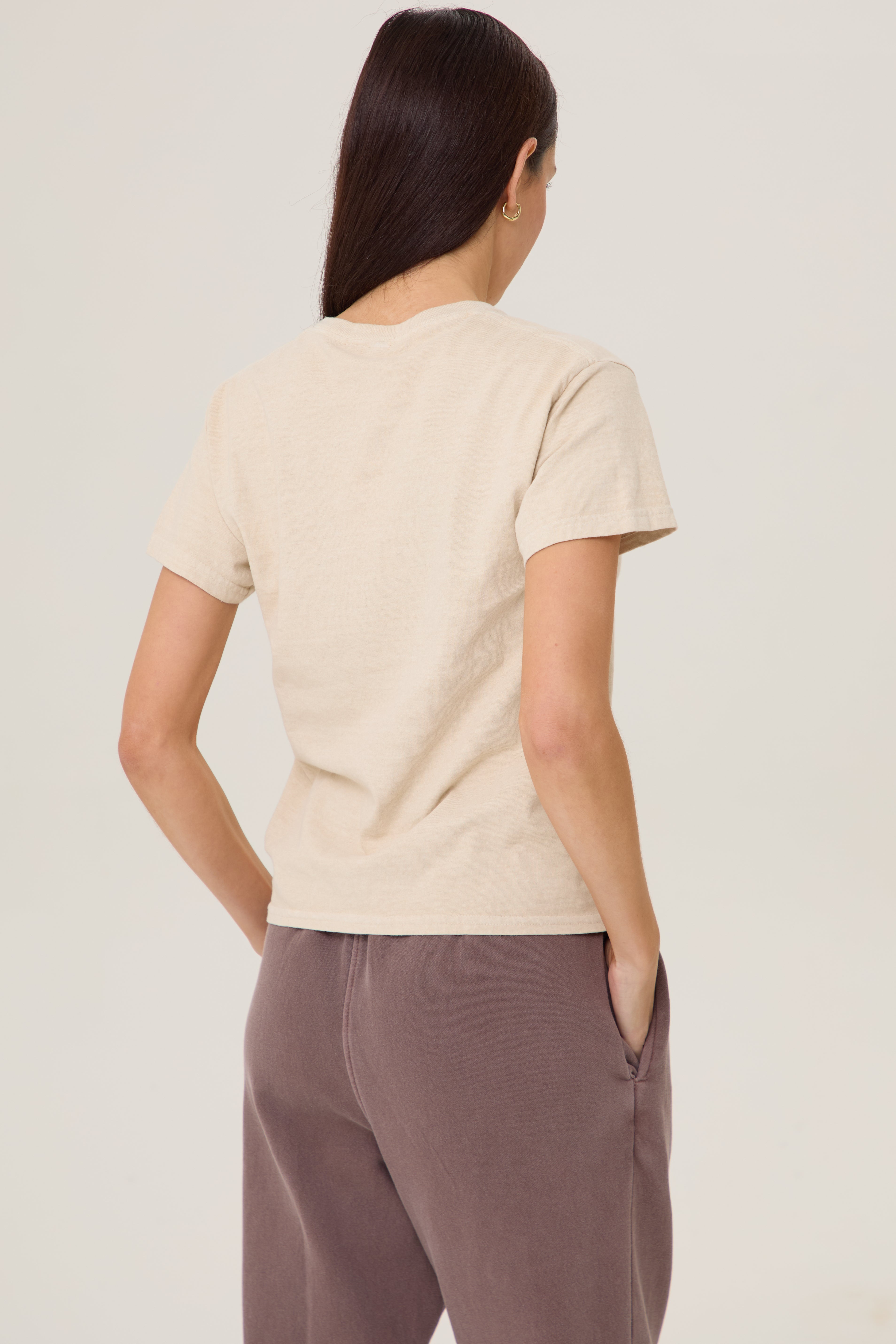 Model wearing Pennbury Cross Country baby tee with joggers