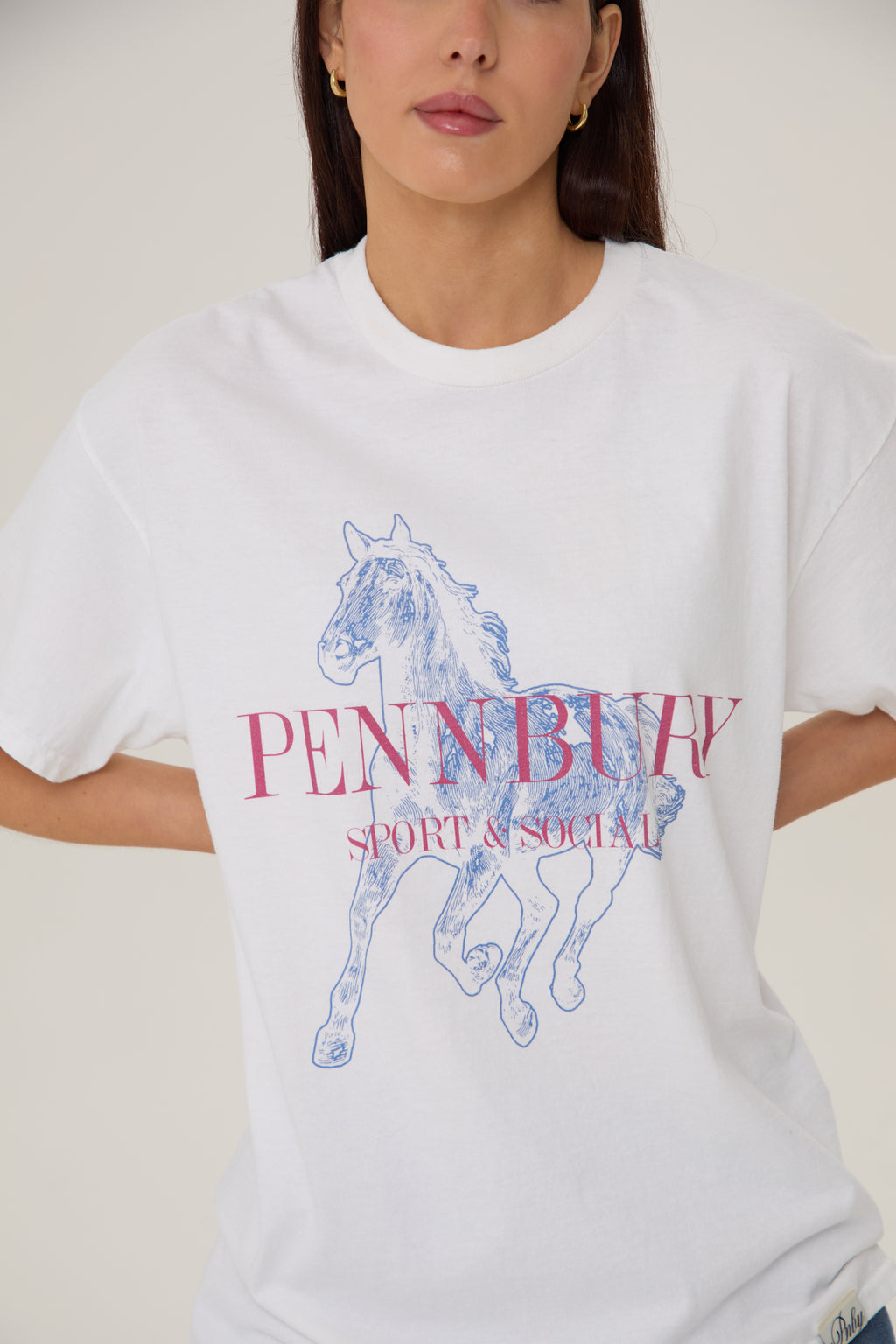 Model wearing Pennbury Dressage oversized graphic t-shirt