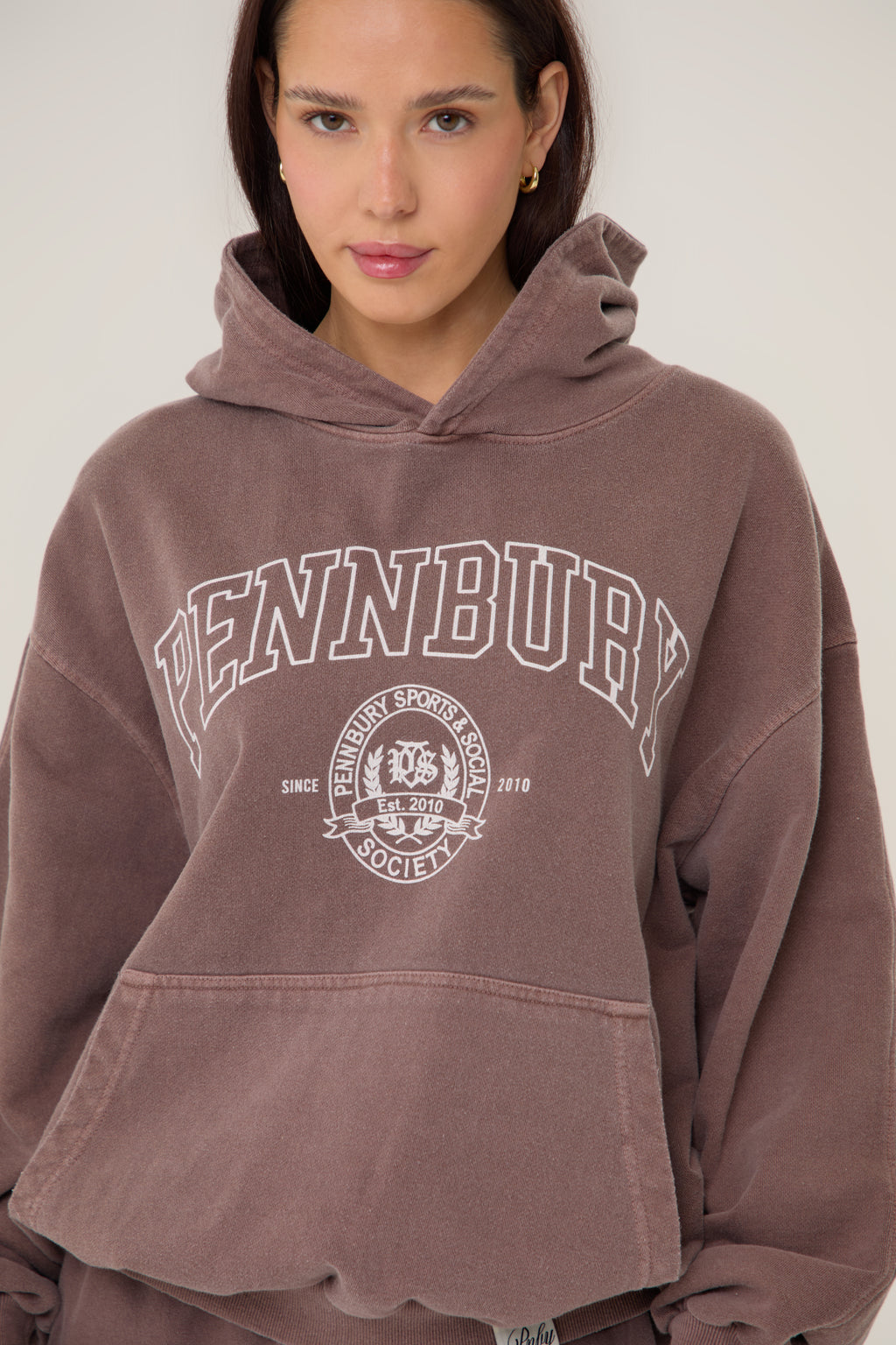 Model wearing Pennbury Grove oversized mocha hoodie 