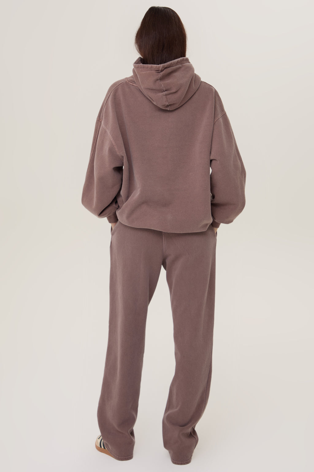 Model wearing Pennbury Grove oversized mocha hoodie with joggers