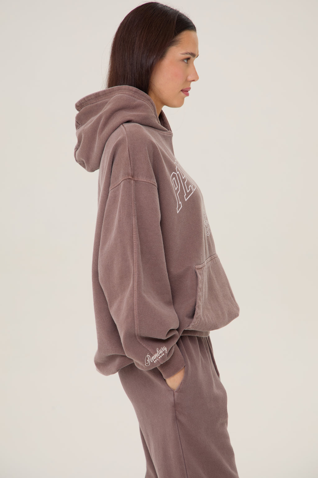 Model wearing Pennbury Grove oversized mocha hoodie with joggers