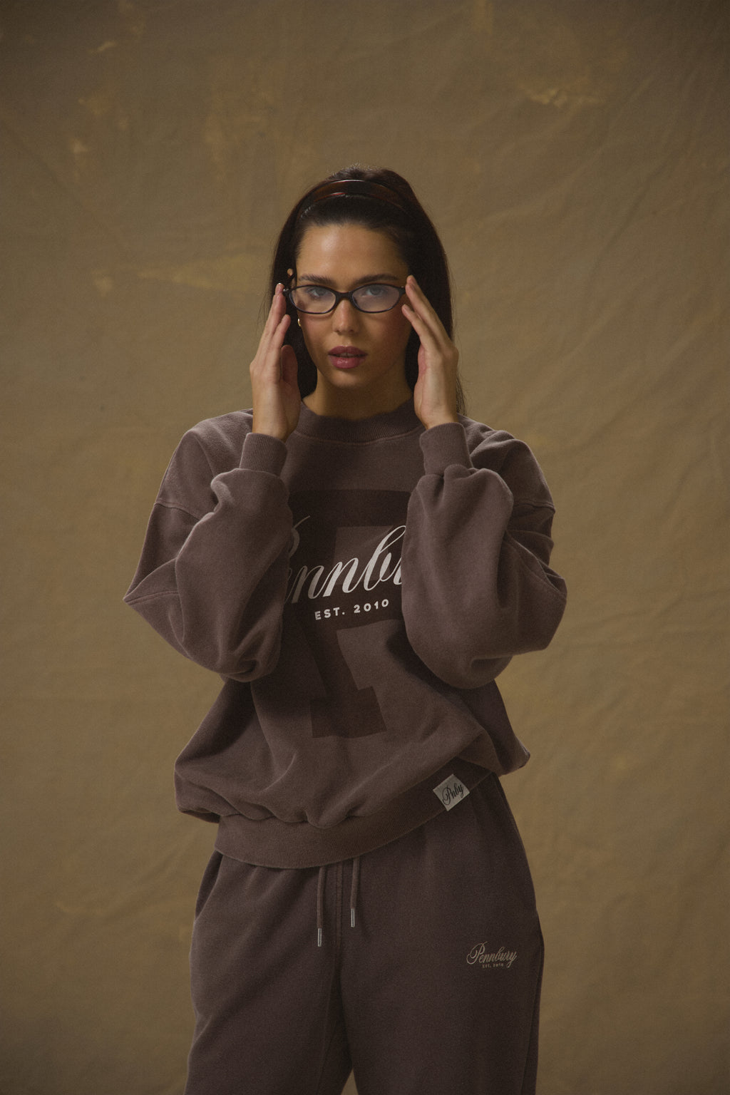 Model wearing Pennbury Prestige mocha oversized sweatshirt