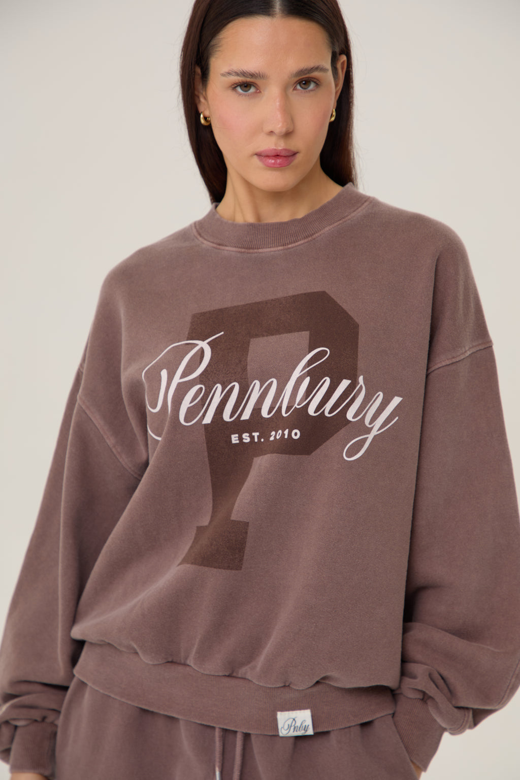 Model wearing Pennbury Prestige mocha oversized sweatshirt