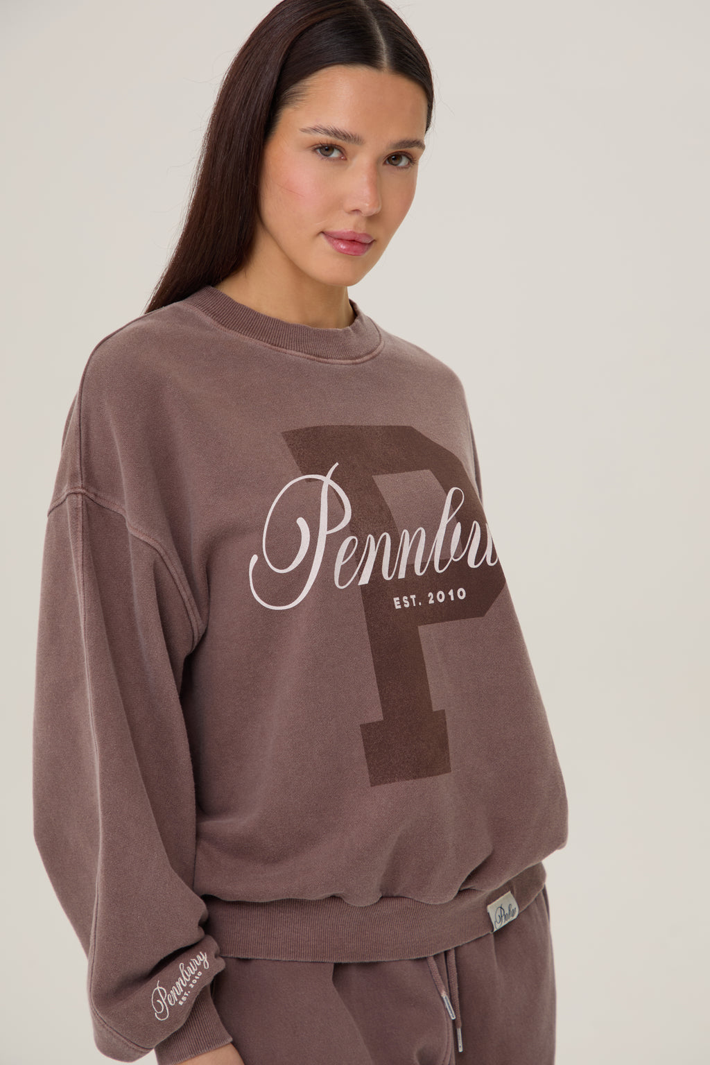 Model wearing Pennbury Prestige mocha oversized sweatshirt