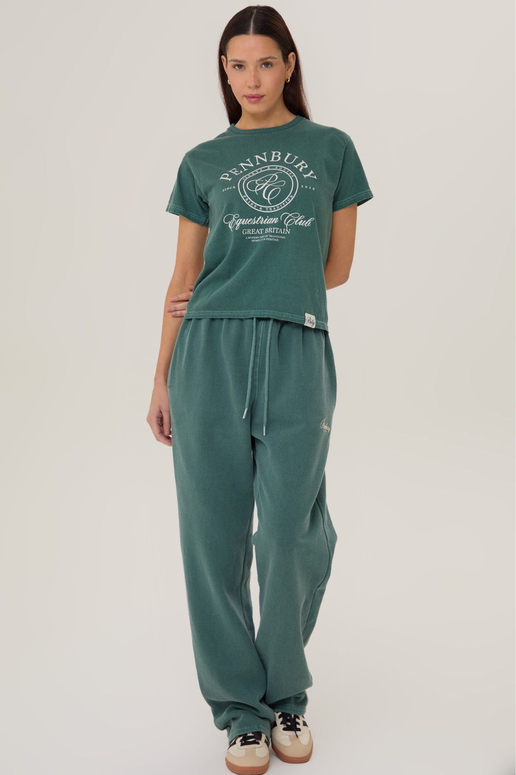 Model wearing Pennbury Racing Green straight leg joggers with tee