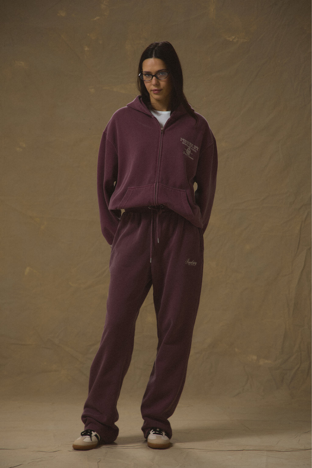 Model wearing Pennbury Regency oversized zip hoodie in vintage wine with joggers