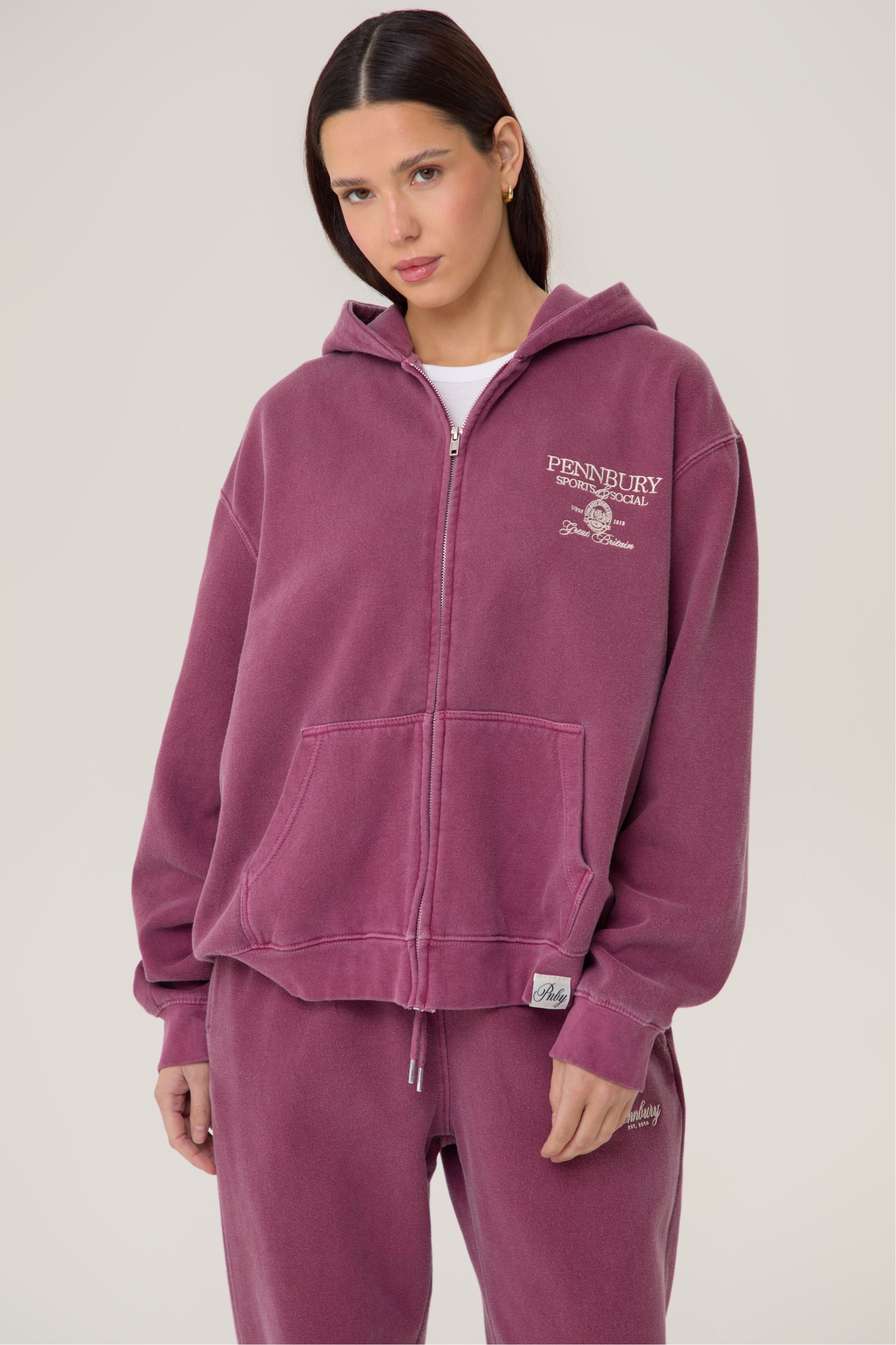 Model wearing Pennbury Regency oversized zip hoodie in vintage wine with joggers