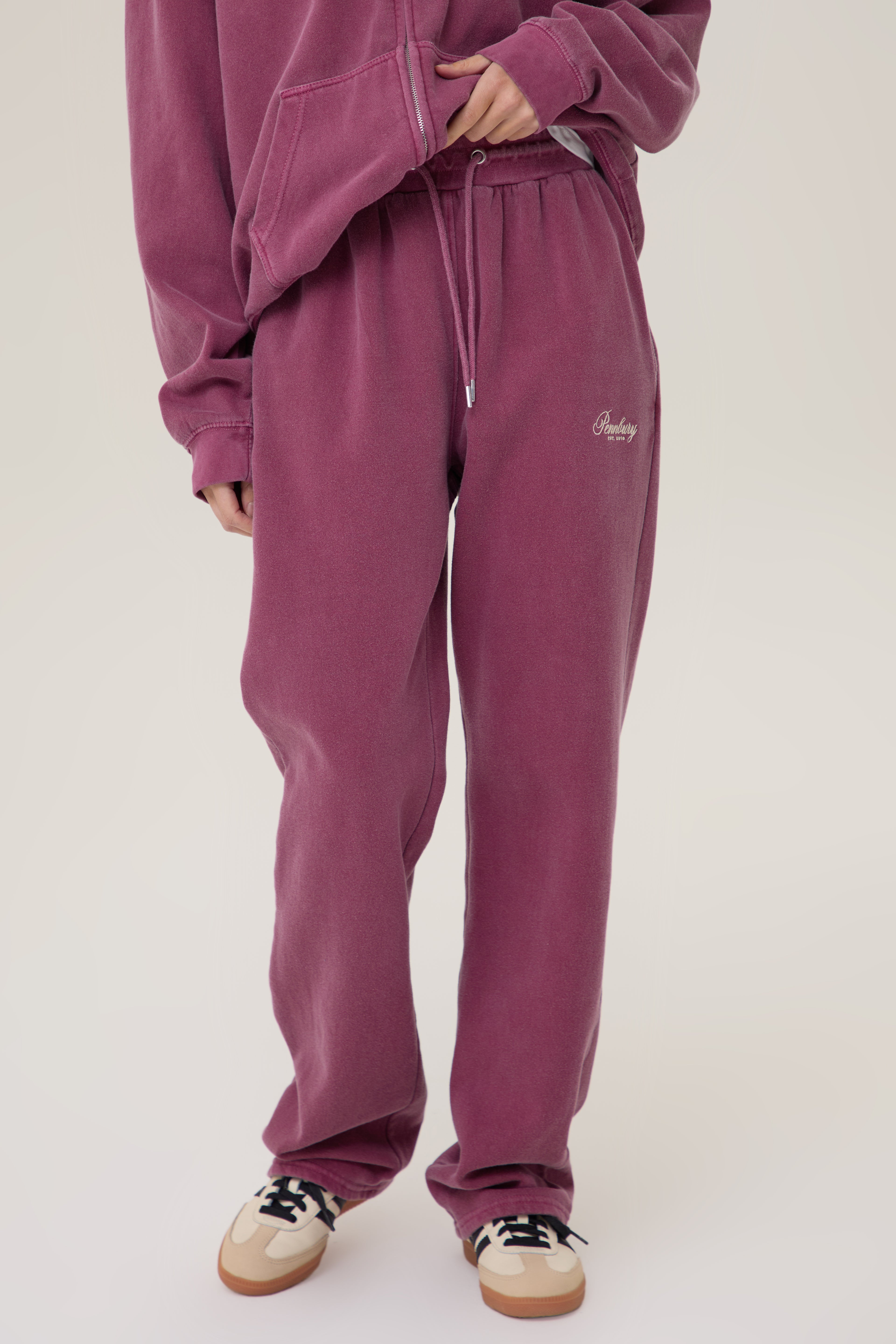 Model wearing Pennbury Regency oversized zip hoodie in vintage wine with joggers