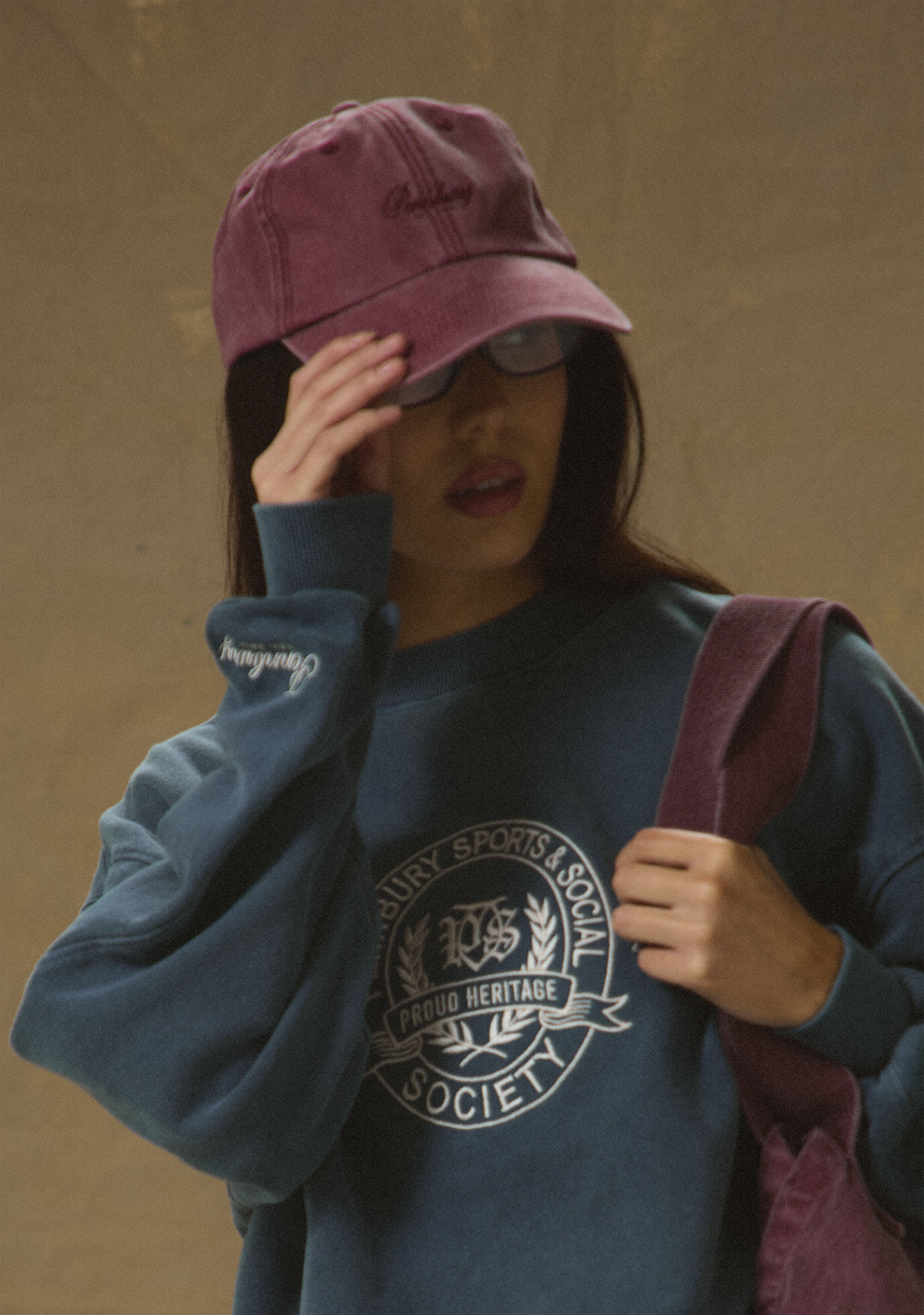 Model wearing Pennbury hoodie, sweatpants, cap and tote bag from the Debut Sports & Socials women’s leisurewear collection
