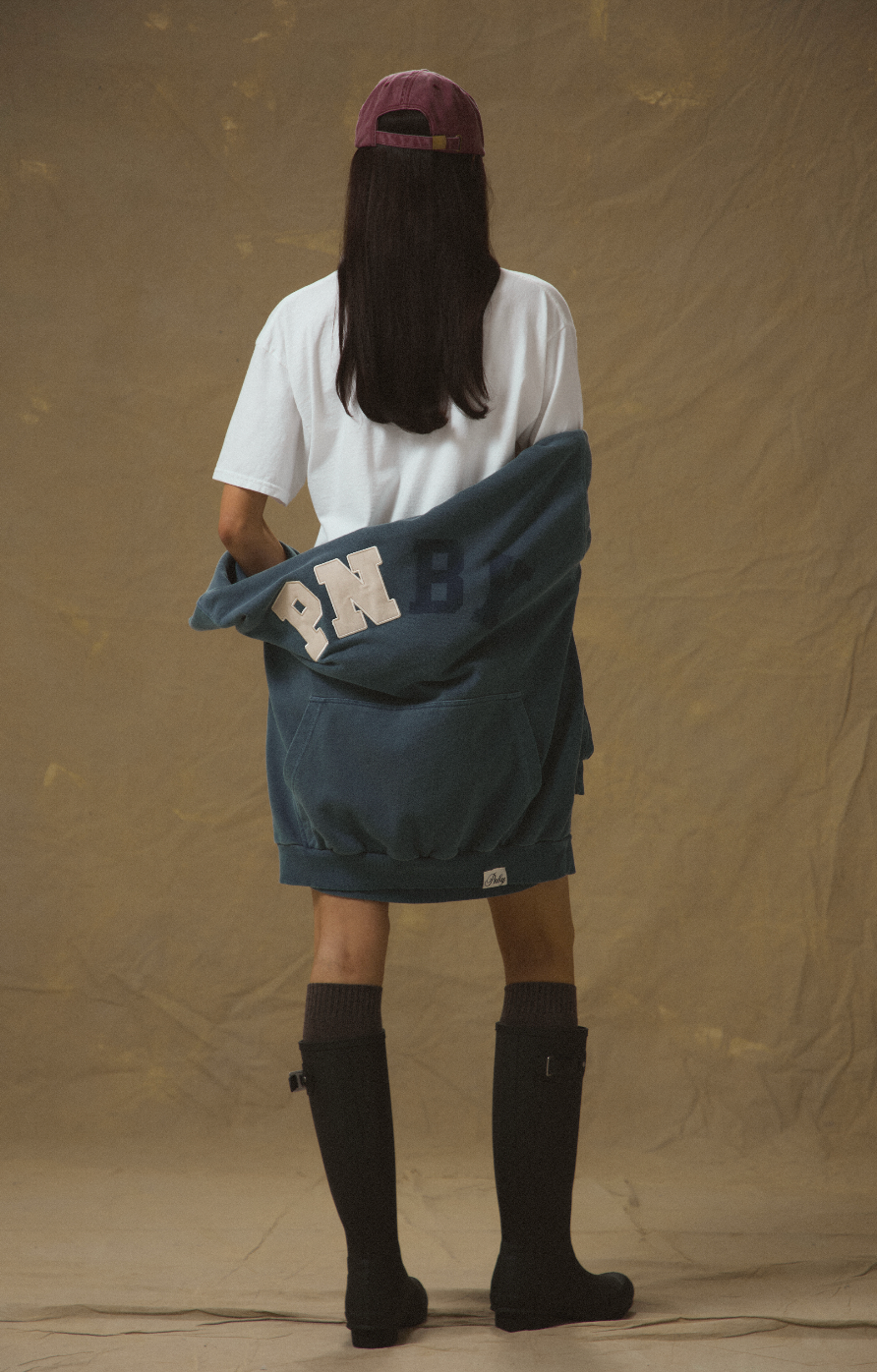 Model wearing Pennbury hoodie, tee and cap from the Debut Sports & Socials women’s leisurewear collection