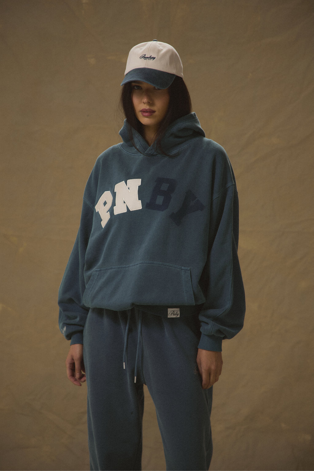Model wearing Pennbury Varsity oversized navy hoodie 