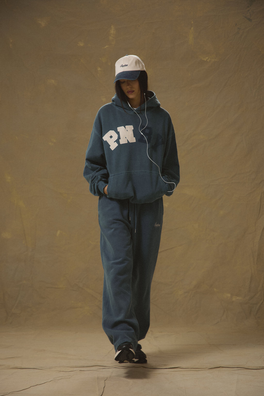 Model wearing Pennbury Varsity oversized navy hoodie with joggers