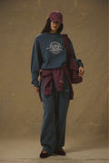 Model wears Pennbury heritage embroidered sweatshirt vintage navy
