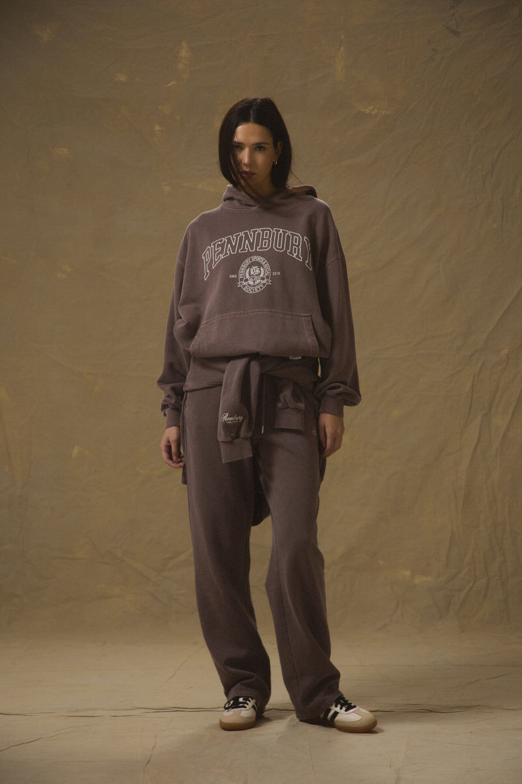 Model wearing Pennbury mocha straight leg joggers