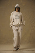 Model wearing Pennbury oat straight leg joggers