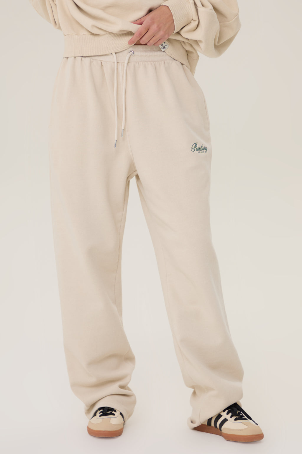 Model wearing Pennbury oat straight leg joggers