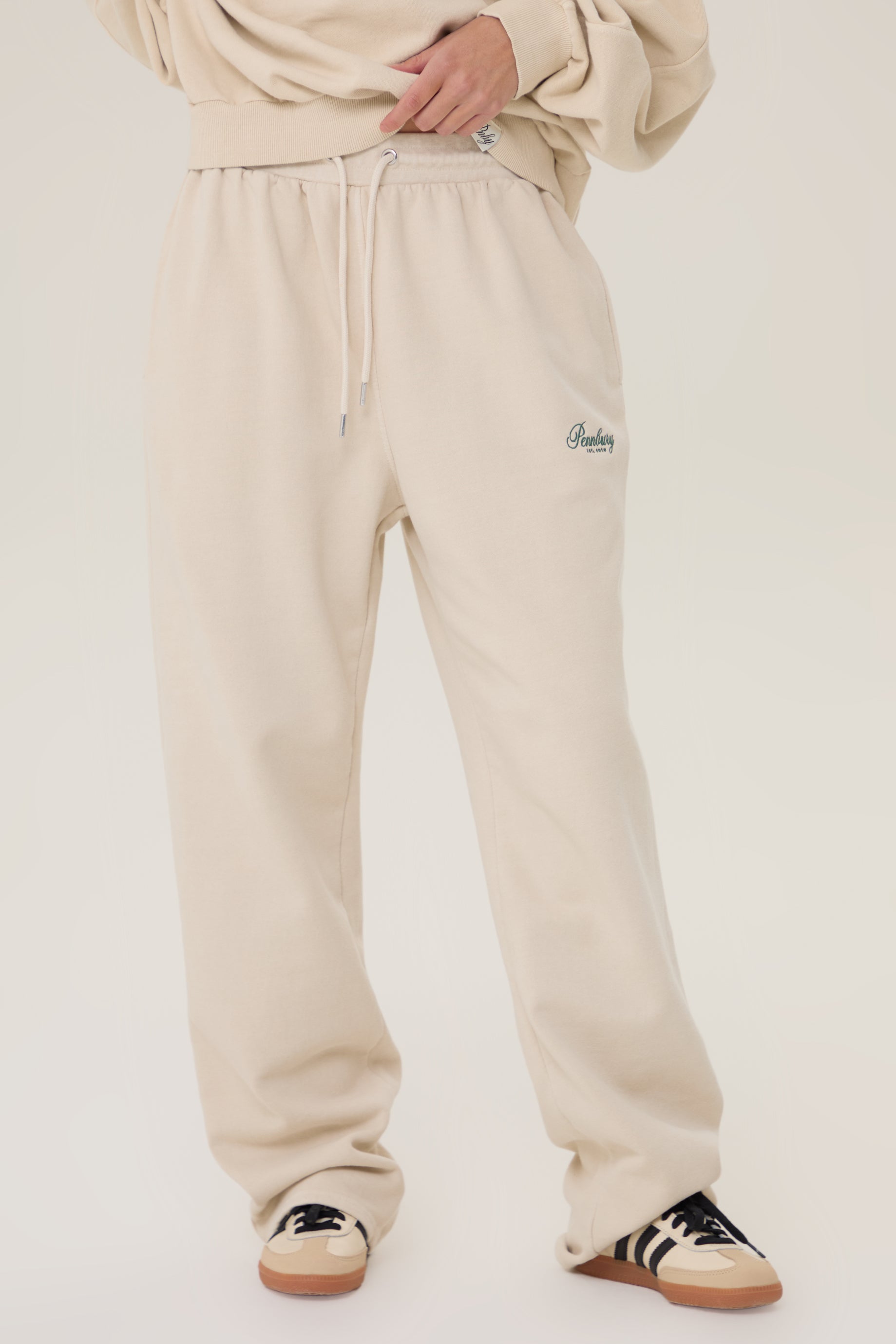 Model wearing Pennbury oat straight leg joggers