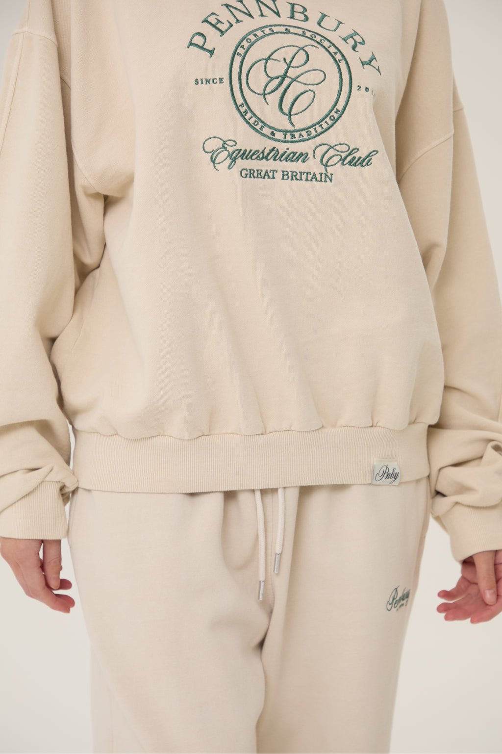 Model wearing Pennbury oat straight leg joggers