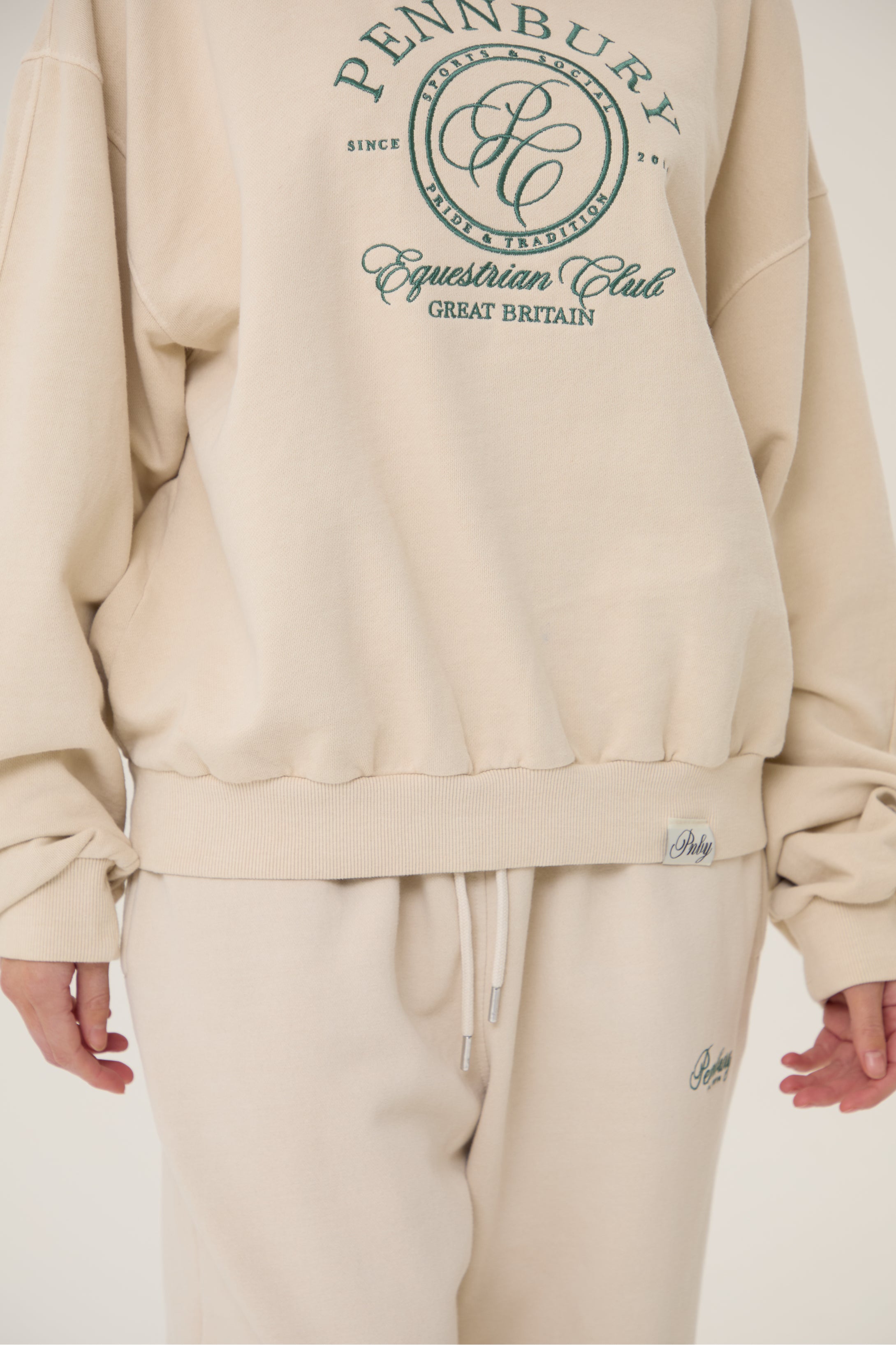 Model wearing Pennbury oat straight leg joggers
