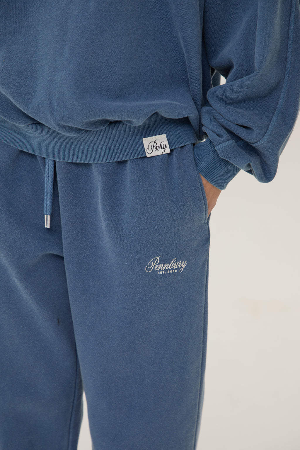  Model wearing Pennbury vintage navy straight leg joggers 