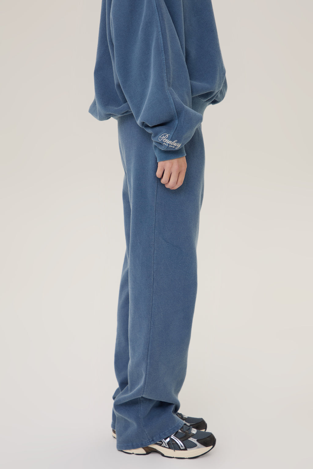  Model wearing Pennbury vintage navy straight leg joggers 