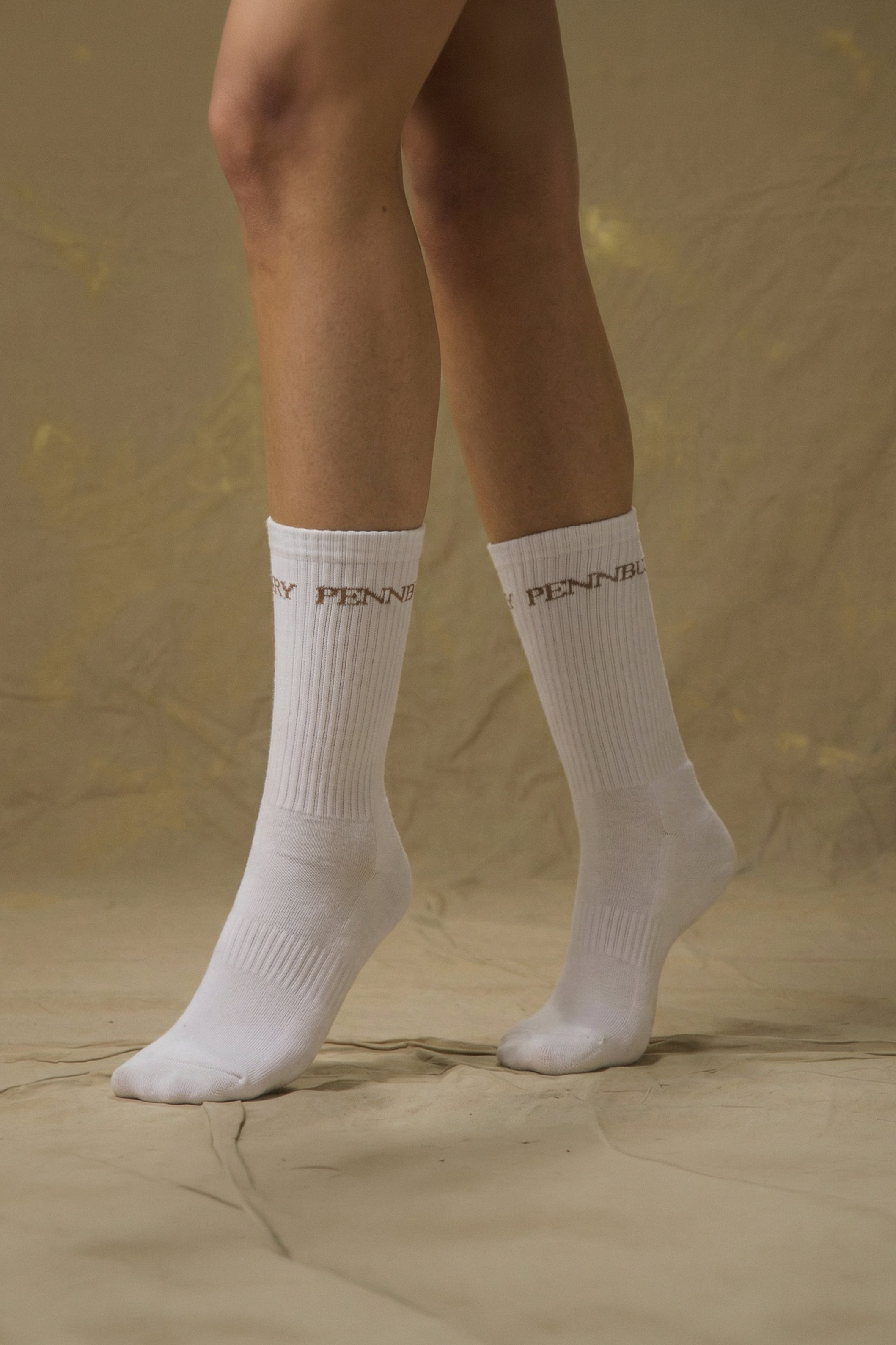 Model wearing Pennbury white sports socks 
