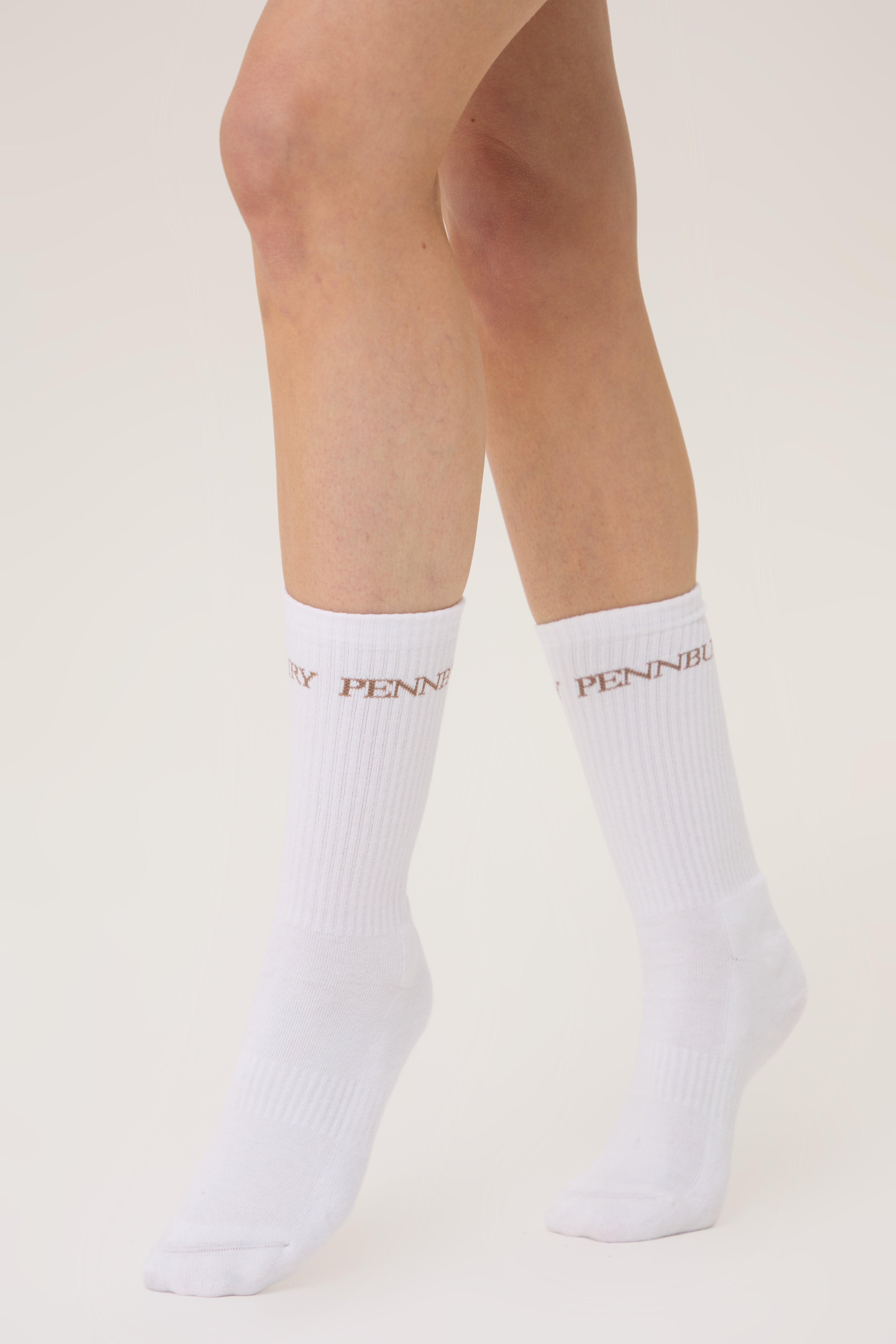Model wearing Pennbury white sports socks 
