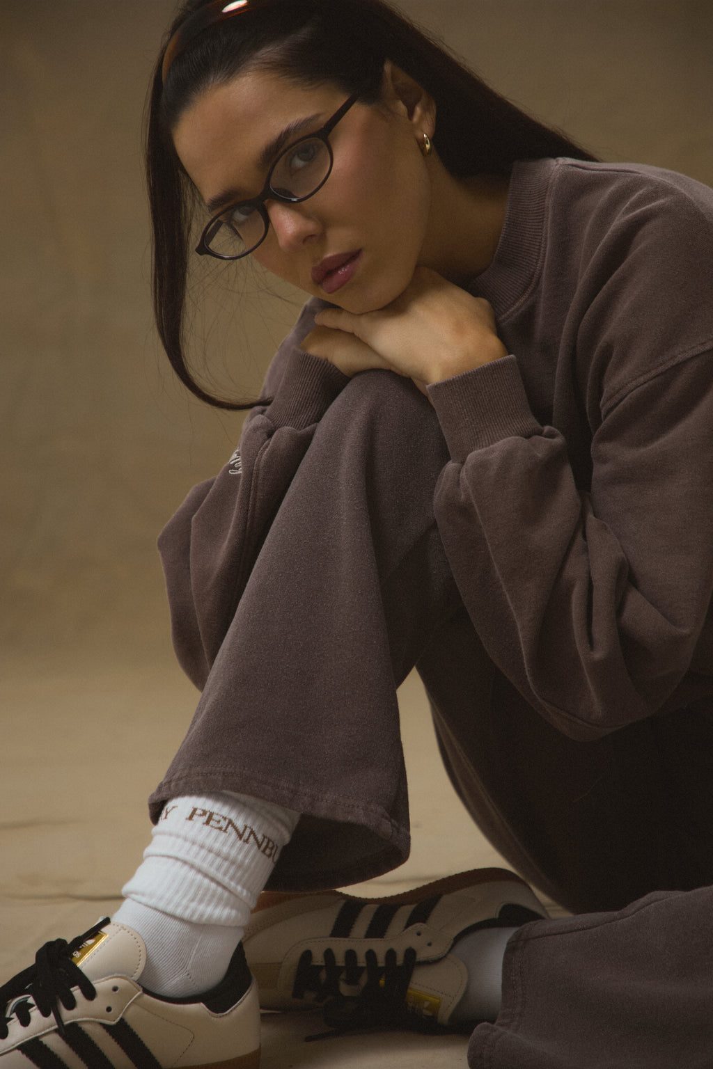 Model wearing Pennbury white sports socks with joggers and sweatshirt