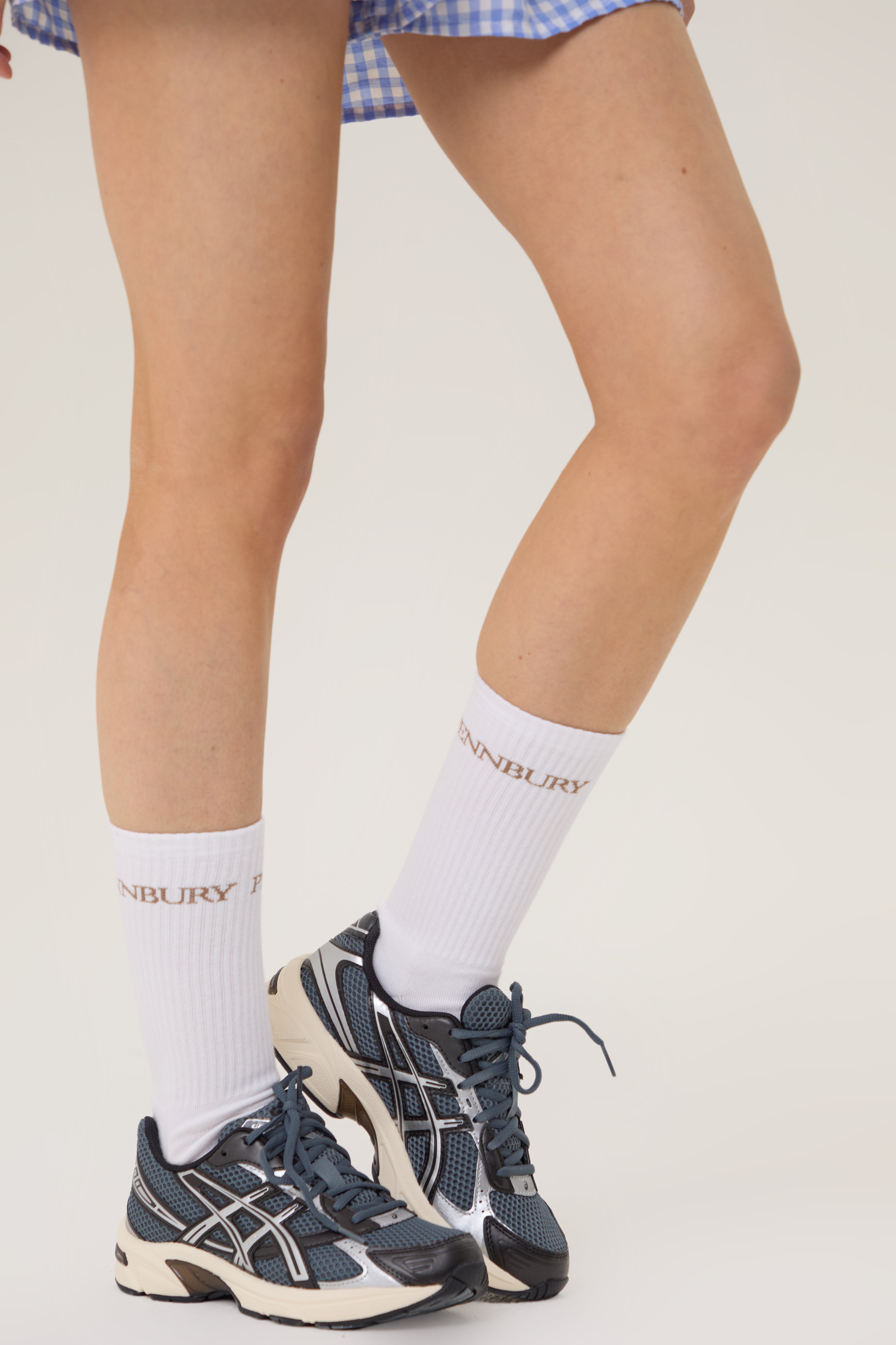 Model wearing Pennbury white sports socks with shorts